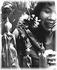 spraying the Buddha with holy water . . .