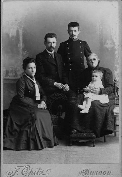 Family photo. Sit: Antonina I. (Kurbatov) and Georgiy A. Behrs, Yekaterina I. Behr (Sablin) holding grandson Vladimir G. Behr. Stands: Nikolay A. Behr, brother of Georgiy A. Behr.