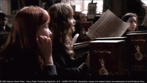 Hermoine Granger(Emma Watson) giggling over Gilderoy Lockhart (Kenneth Branagh)