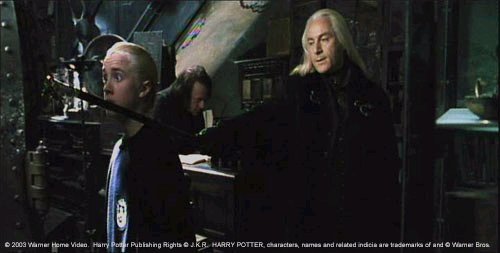 Lucius Malfoy (Jason Isaacs) and his son Draco in Knockturn Alley