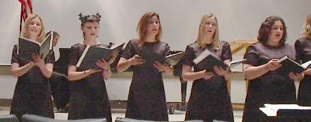 Some girls singing at a concert