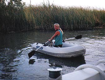 MIke with Brutus on the dinghy