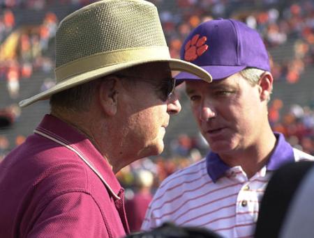 Clemson's head coach Tommy Bowden talks to his father, Florida State's head coach Bobby Bowden before the start of their game in 2001. Photo courtesy Associated Press.