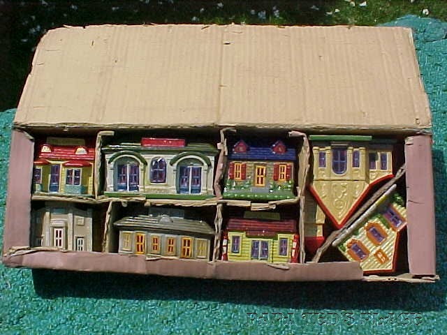 COMPOS, or "composition" houses are actually gypsum, or plaster-of-paris reinforced with a little fiber for strength, though you could hardly call them strong! This boxed set of the basic 8 village pieces is over 60 years old, brand new, and there is no company name on the box, which is completely plain and unadorned except for the price: 98 cts.! and the ubiquitous "Made in Japan." 