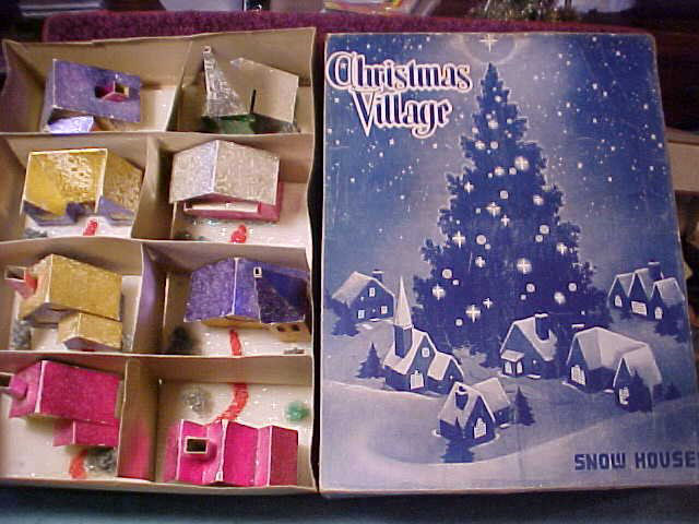 Dolly Toy made this basic set of eight in this same box from just before WW II until they stopped production in the early '50's. This same set of designs can be found in several finishes, from colored plain tinfoil to glass bead on foil to multicolor sparkle on plain white cardstock to the absolutely stark, white unadorned cardstock from the depths of The War, when not even the tinfoil could be spared from Defense Production. Sets of PRINTIES can also be found in this same box. Shown are the last of the series: - very late 40's / early '50s - as can be ascertained from the fact that the bases are styrofoam, rather than the usual flimsy cardboard open box-style with the corner-rivet staples. 