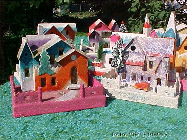 Another early hacienda : unusually dark with an intrinsic cardboard tree, this also had the brown composition figure but all that remains is the pair of "feet" in the front yard. 