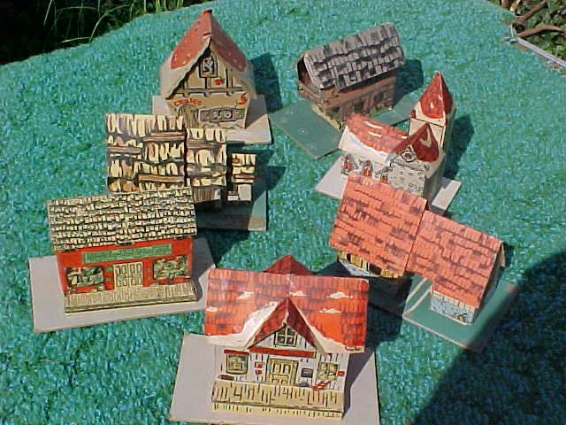 1946. Johnstown, PA. Christmas. The tree and village already up. I was quarantined at home from kindergarten with measles. There was a "QUARANTINED!" card tacked on the front door.( They did those things in those days. ) Brother Jim was just over a year old, crawling and scooting around enough to do real damage. Mom came home from downtown errands with a set of these. She was delighted as we put them under the tree - the first replacements she'd been able to get for our plain old wartime DOLLIES, which had gotten pretty shabby by that time, doors and windows all punched out by little punchy-fingers (guess who?) -sat on, spilled on and just generally played to death. I loved 'em! 