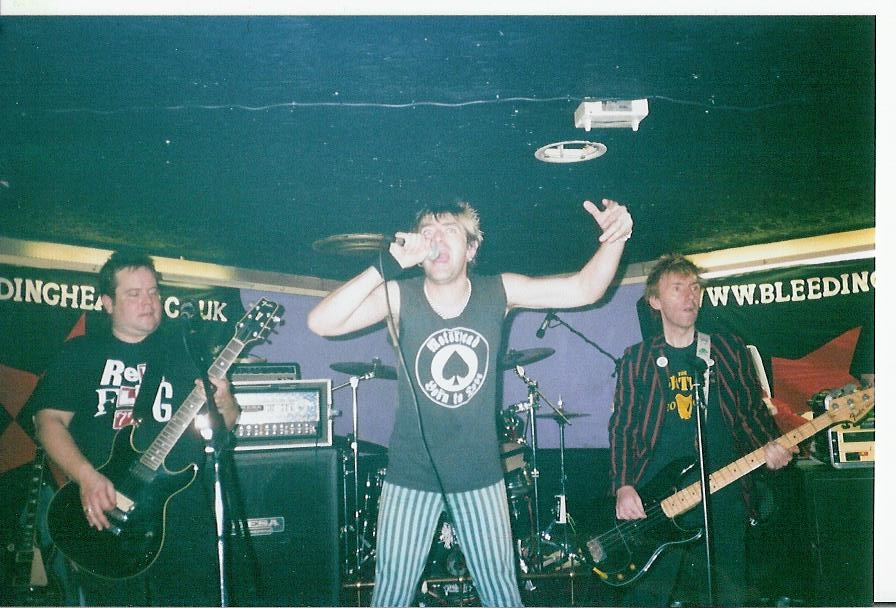 Red Flag 77 show the plastic lefties how it's done at a Puke gig (by Jemma)