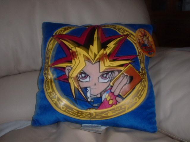 Ooohhh!! My Yami Yugi pillow! I got it for graduation and started screamin' a bit.. :D