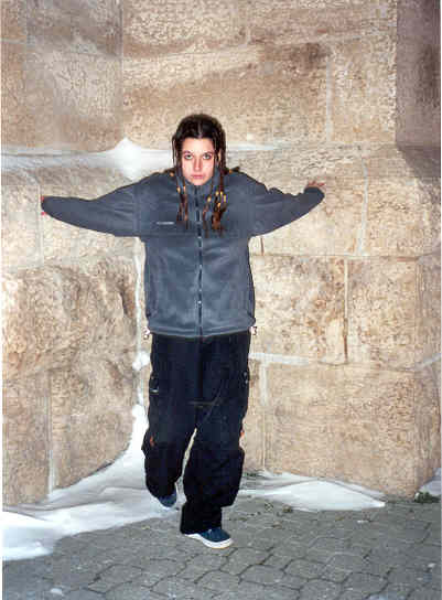 emerging from the wall