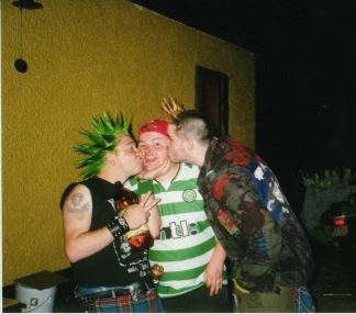 some fella gettin a kiss off Mickey and Trasko