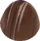 Banana creme with caramel sauce in a milk bomb shell with dark and white stripes