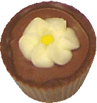 Hazelnut praline in a milk choc cup decorated with a flower