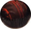 Dark orange ganache in a dark choc enrobed shell with orange stripes