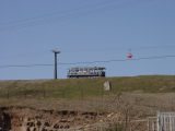 A closer view of one of the trams and a cable car