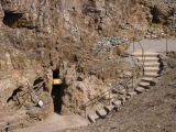 The entrance to the mine is below the sign