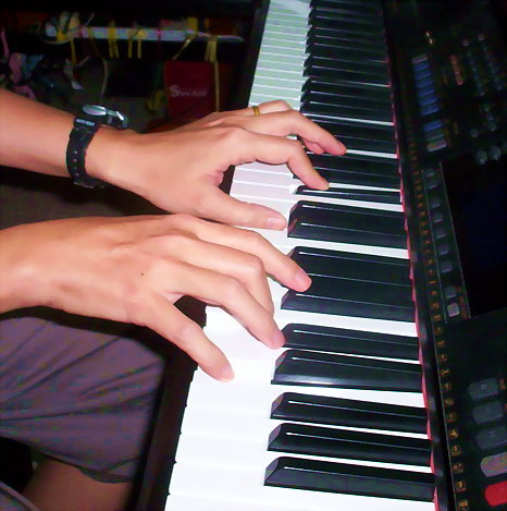 My hands on my Yamaha Clavinova