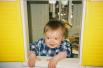 Megan loves to play in the plastic house at Little Goslings daycare.