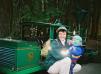 This Stanley Park train has a green engine.  (Wow those reflective stripes are bad when you have a flash!)