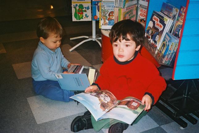 January? Outing to Granville Island.  Tim immediately starts reading any Thomas books in the shop, and Megan copies him.