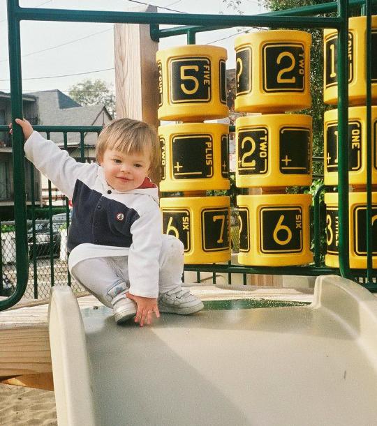 Feb 28? 2003, Oakland, CA. Megan climbing onto a playground slide.