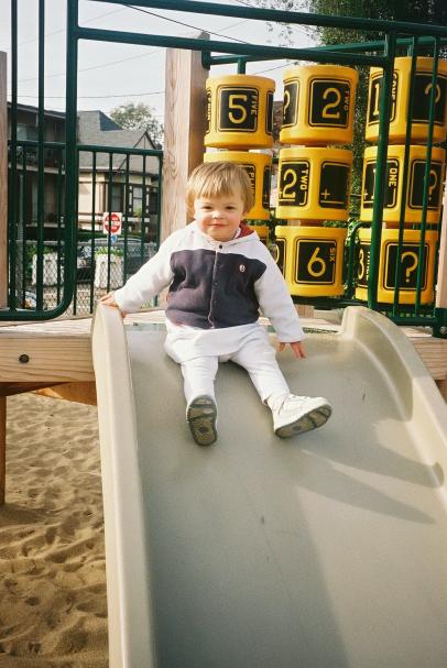 Feb 28, Oakland CA. Ready to go down the slide! She loves slides.