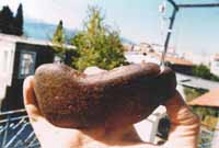 Handsome hatchet of jasper gemstone presented in the sun of Nafpaktos