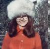 What bozo gets married in scarlet looking like Mother Christmas?????