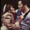 Eponine -shortly after being shot- falls into the arms of Marius, and attempts to rip his shirt off . . . from Les Miserables