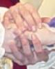 A whole mess of hands.&nbsp; There's three people with a total of four hands, actually.