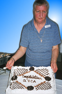 Emily Howe, Recording Secretary cuts the cake