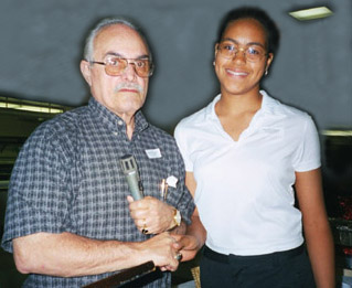 Theresa Serrano receiving the Educational Award from Pat Servillo