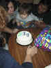 Juan Miguel blowing out the candles with some help from Alicia, Mommie and Grannie while Poppie looks on
