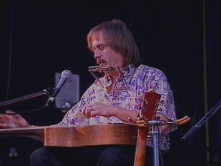 Harmonica Zeke with harmonica and guitar.