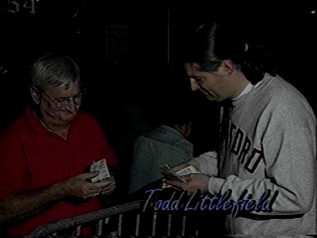 Todd sells CDs after a performence.