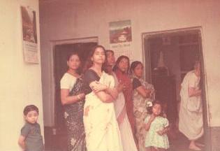 Mrs Jharna Das with group waiting outside kitchen