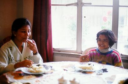 Sudarshana and Dona enjoy conversation and snacks