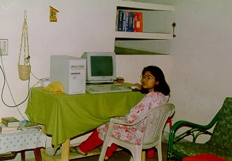 Sulagna looks back from computer desk
