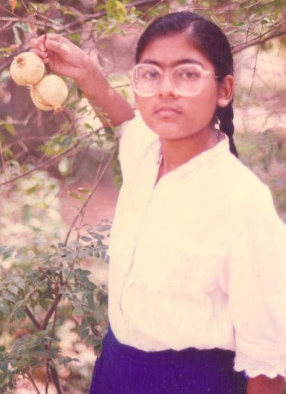 Sulagna watches the growth of pomegranades in her garden