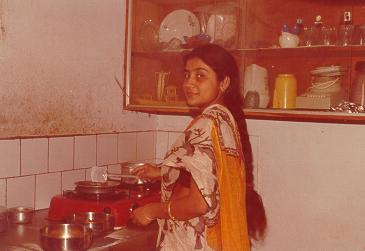 Rachana cooks chapati on gas stove, she is famous for thin chapatis