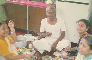 Mr. Sushil Mullick can't refuse the sweets, specially Sandesh offered by 3 sisters