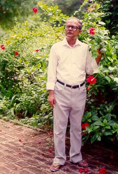 A hibiscus shrub is a cool place for Mr. S.R.Das