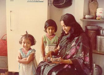 Sulagna with younger sis Sudarshana showing album to Mrs. Protima Das
