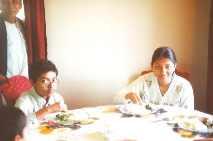 Sudarshana and N enjoying rice and chicken