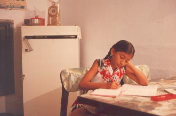Sudarshana doing home work for school