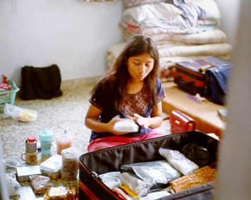 She packs her bag with great attention
