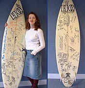 ALISON WITH A SURFBOARD THAT LOADS OF ARTISTS AND BANDS SINGNED,THIS SURFBOARD WENT TO 1 LUCKY LISTENER OF THE HOT30