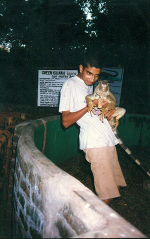 handling an iguana during training at the Madras crocodile bank