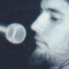 Performing poetry accompanied by Derek Vokey in the early 90's. Photo by Ray13 of Bad Luck #13.