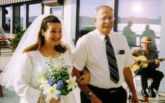 Andrea makes her entrance with dad